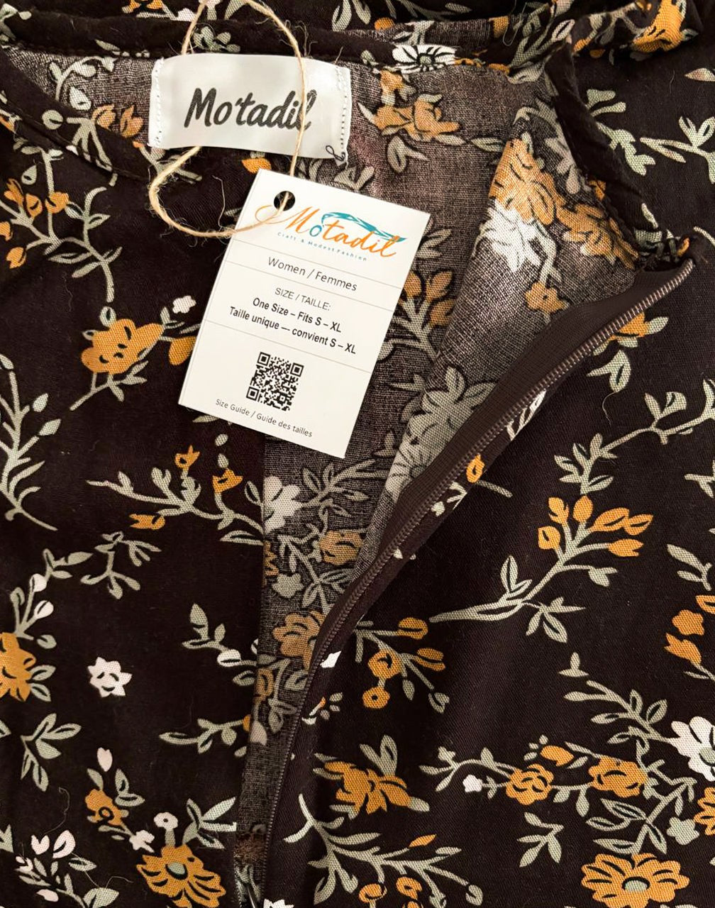 Inside of the floral maxi dress showing the MO'TADIL label and size tag