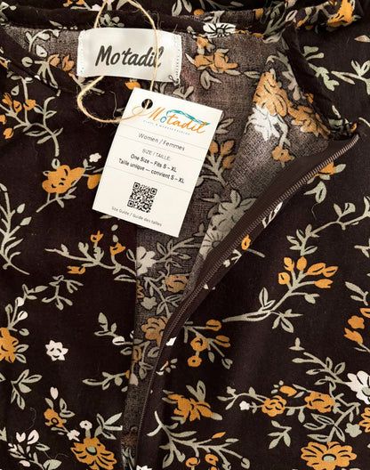 Inside of the floral maxi dress showing the MO'TADIL label and size tag