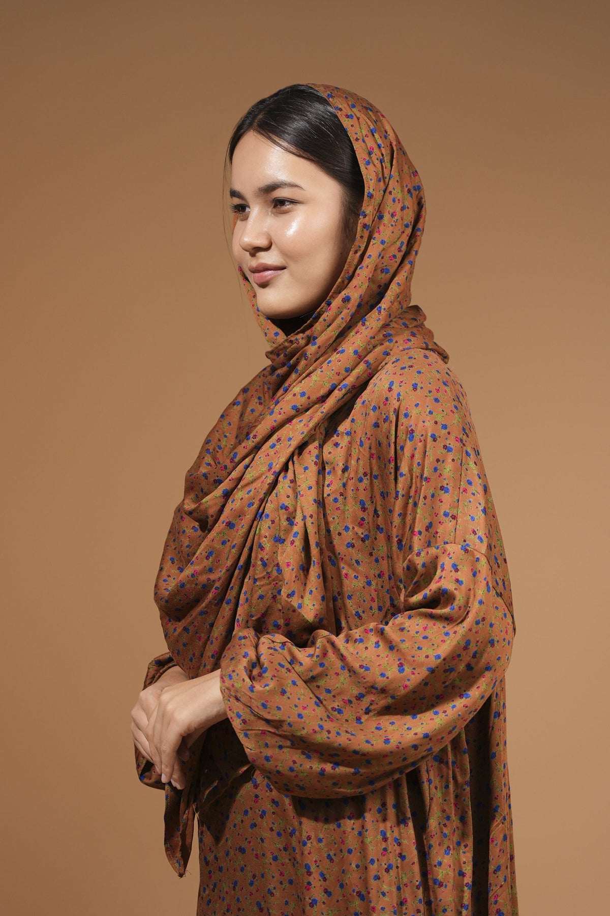 Brown maxi dress with built-in scarf, draped over the shoulders