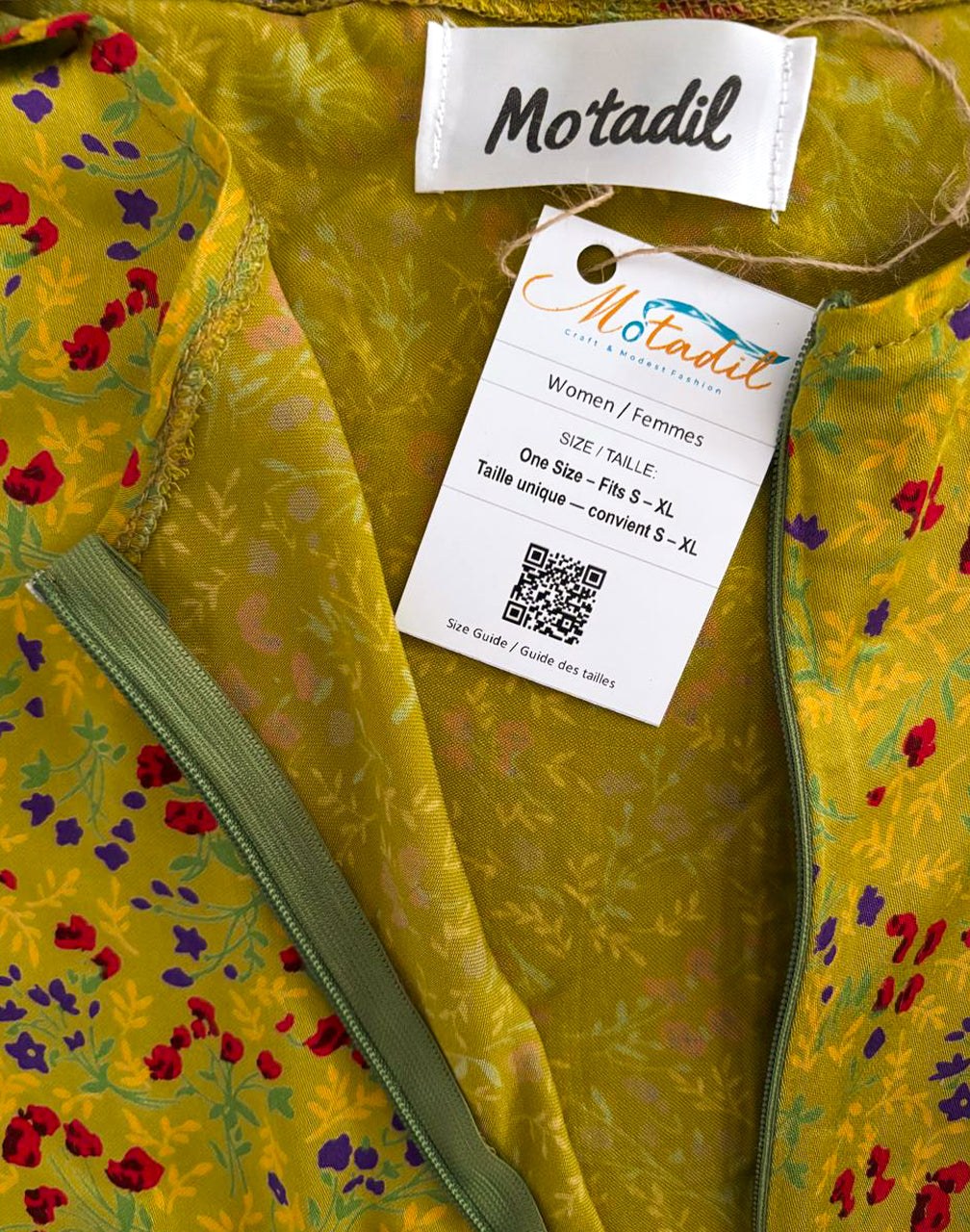 Inside of the green floral dress showing the MO'TADIL label and size tag