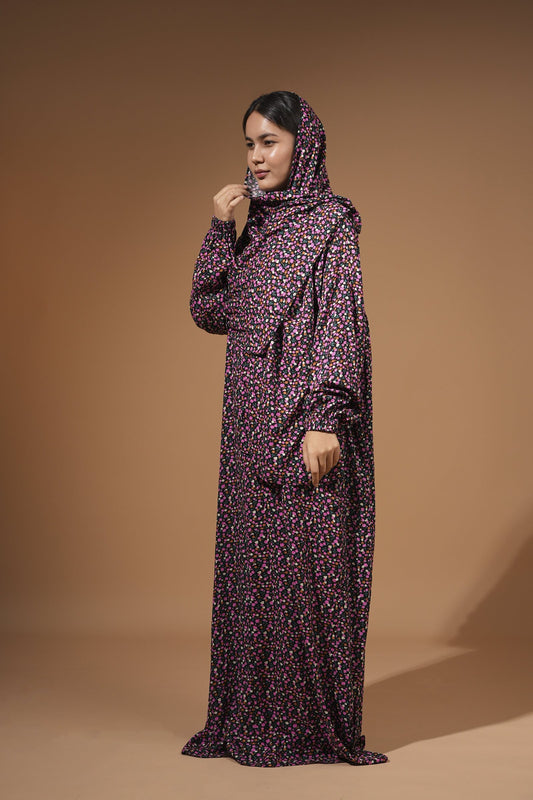 Woman wearing the pink and purple floral maxi dress with built-in scarf
