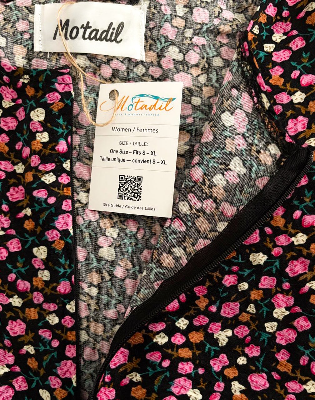 Inside of the pink floral maxi dress showing the MO'TADIL label and size tag